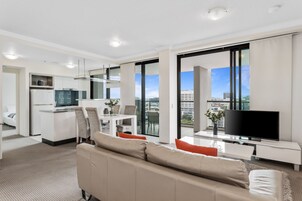 Apartment, 2 Bedrooms, 2 Bathrooms (1 Queen & 2 Single Beds) | Living area | Flat-screen TV