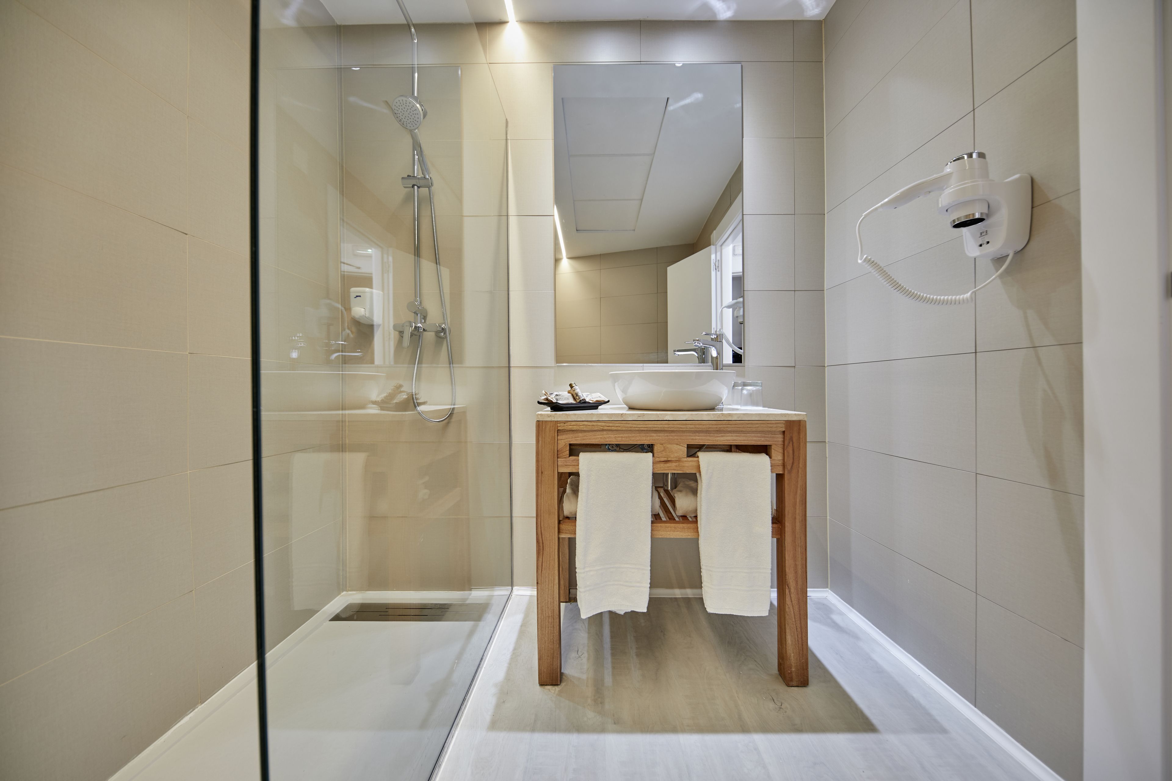 shower, free toiletries, hair dryer, towels