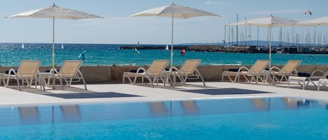 Indoor pool, seasonal outdoor pool, pool umbrellas, sun loungers