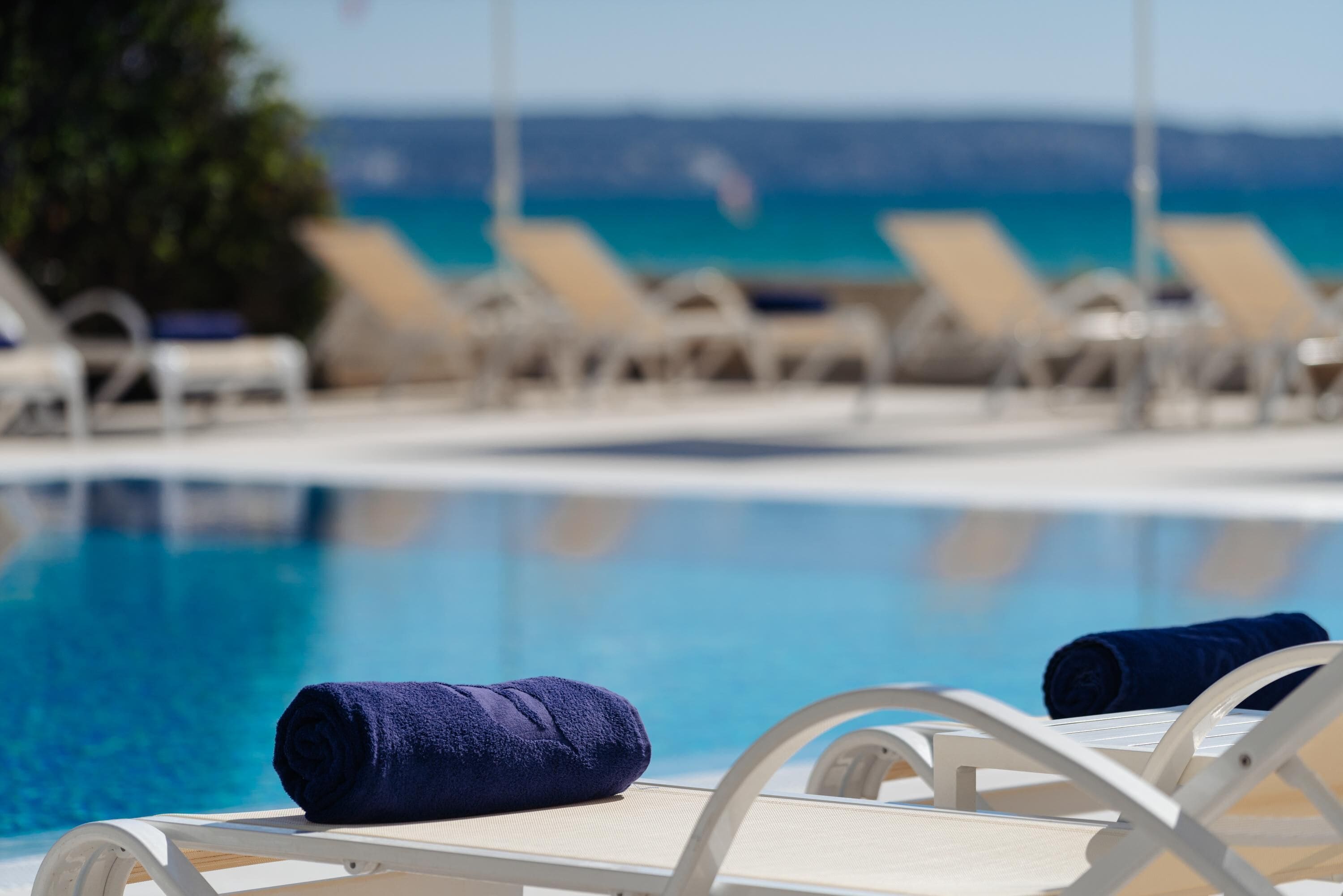 indoor pool, seasonal outdoor pool, pool umbrellas, pool loungers