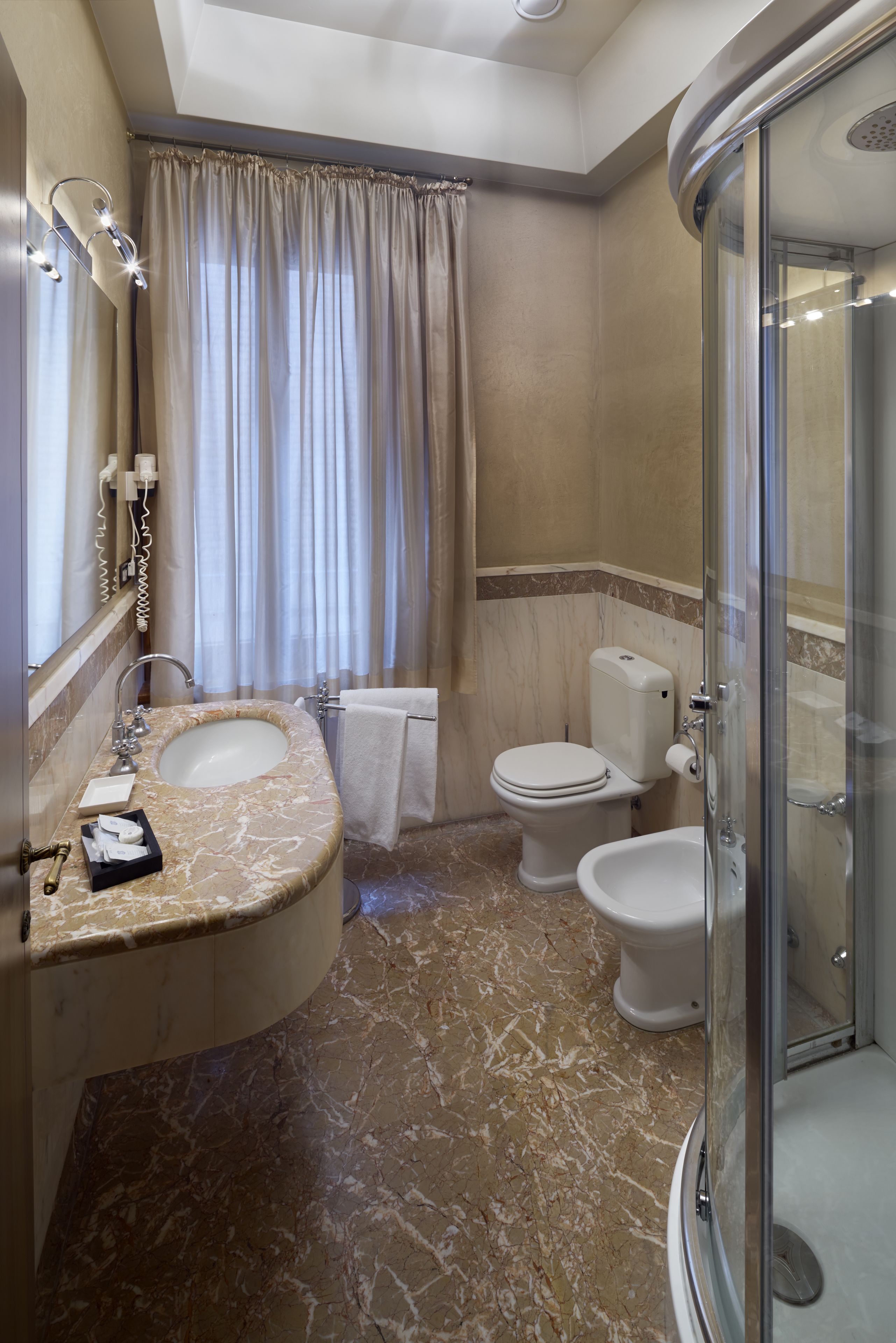 deluxe double room | bathroom | free toiletries, hair dryer, slippers, bidet