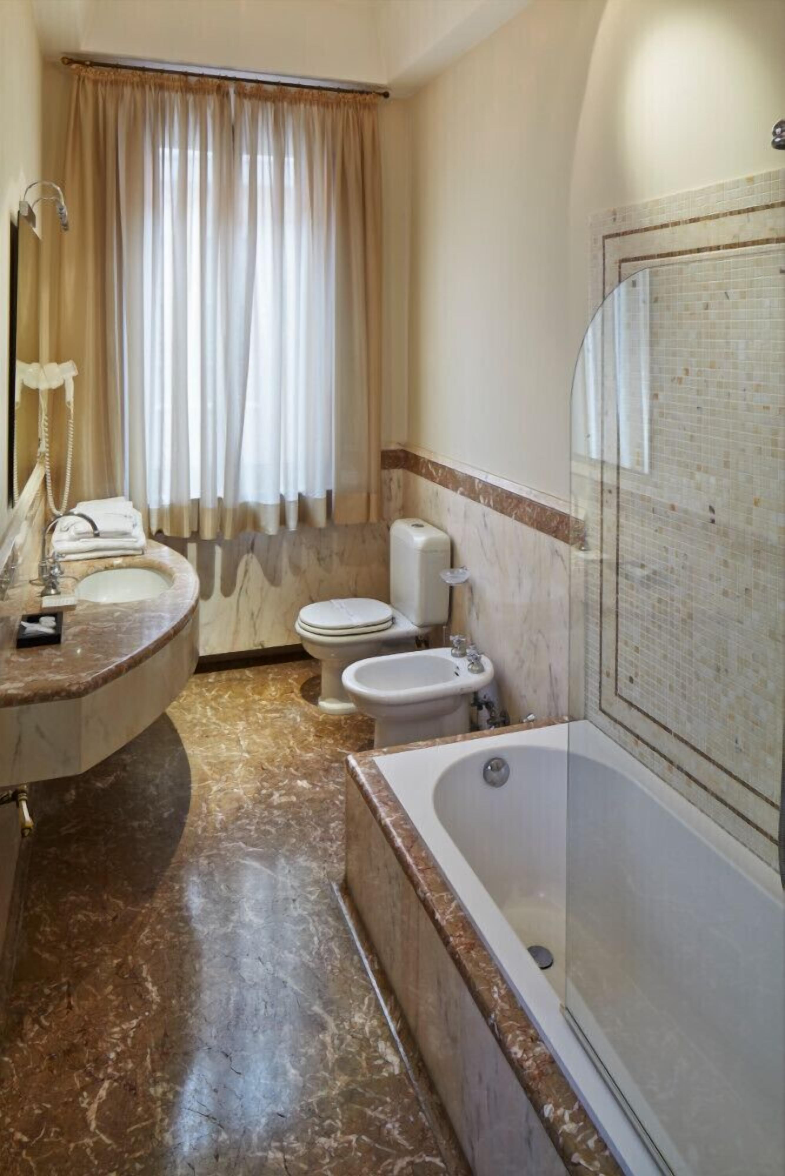 free toiletries, hair dryer, slippers, bidet