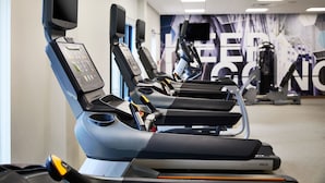 A gym with treadmills and exercise equipment. - SpringHill Suites St. Louis Brentwood (Brentwood)