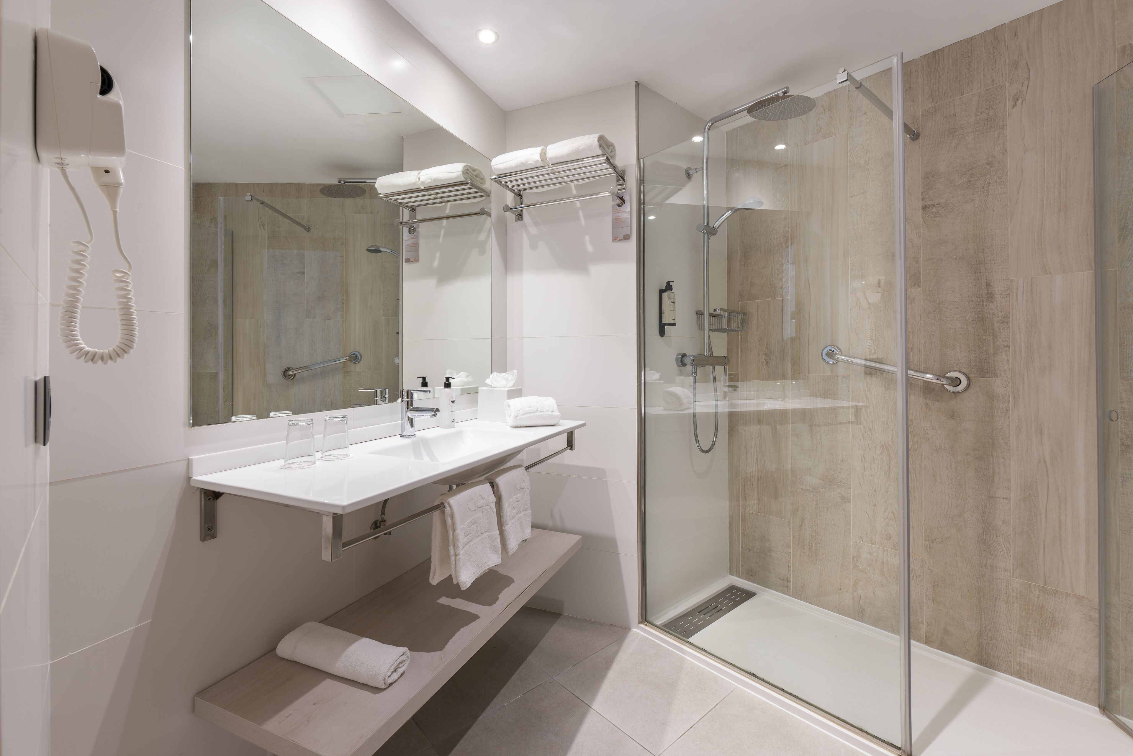 junior suite, balcony, sea view | bathroom | shower, free toiletries, hair dryer, towels