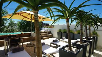 2 outdoor pools, pool umbrellas, pool loungers