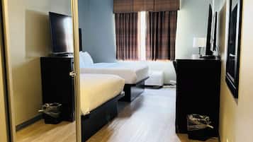 Premium bedding, desk, laptop workspace, blackout curtains