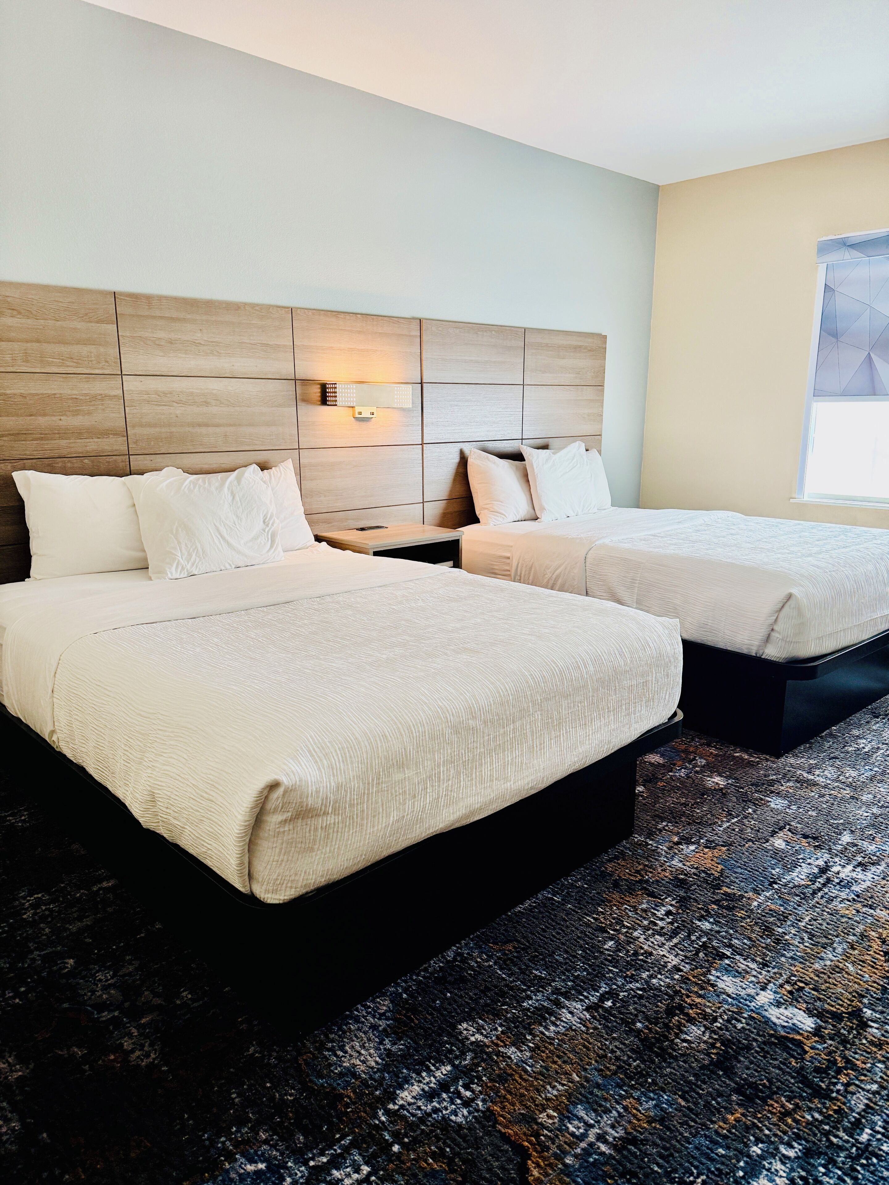 Premium bedding, desk, laptop workspace, blackout curtains