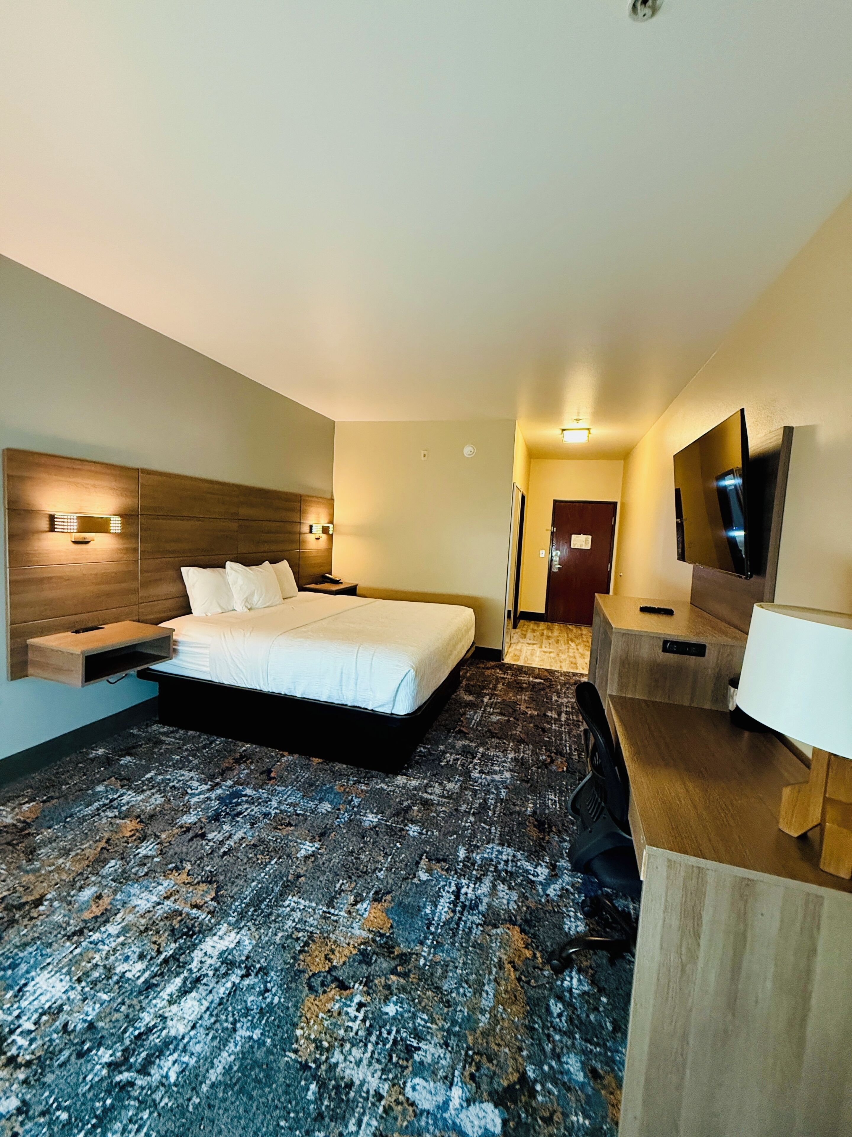 Premium bedding, desk, laptop workspace, blackout curtains