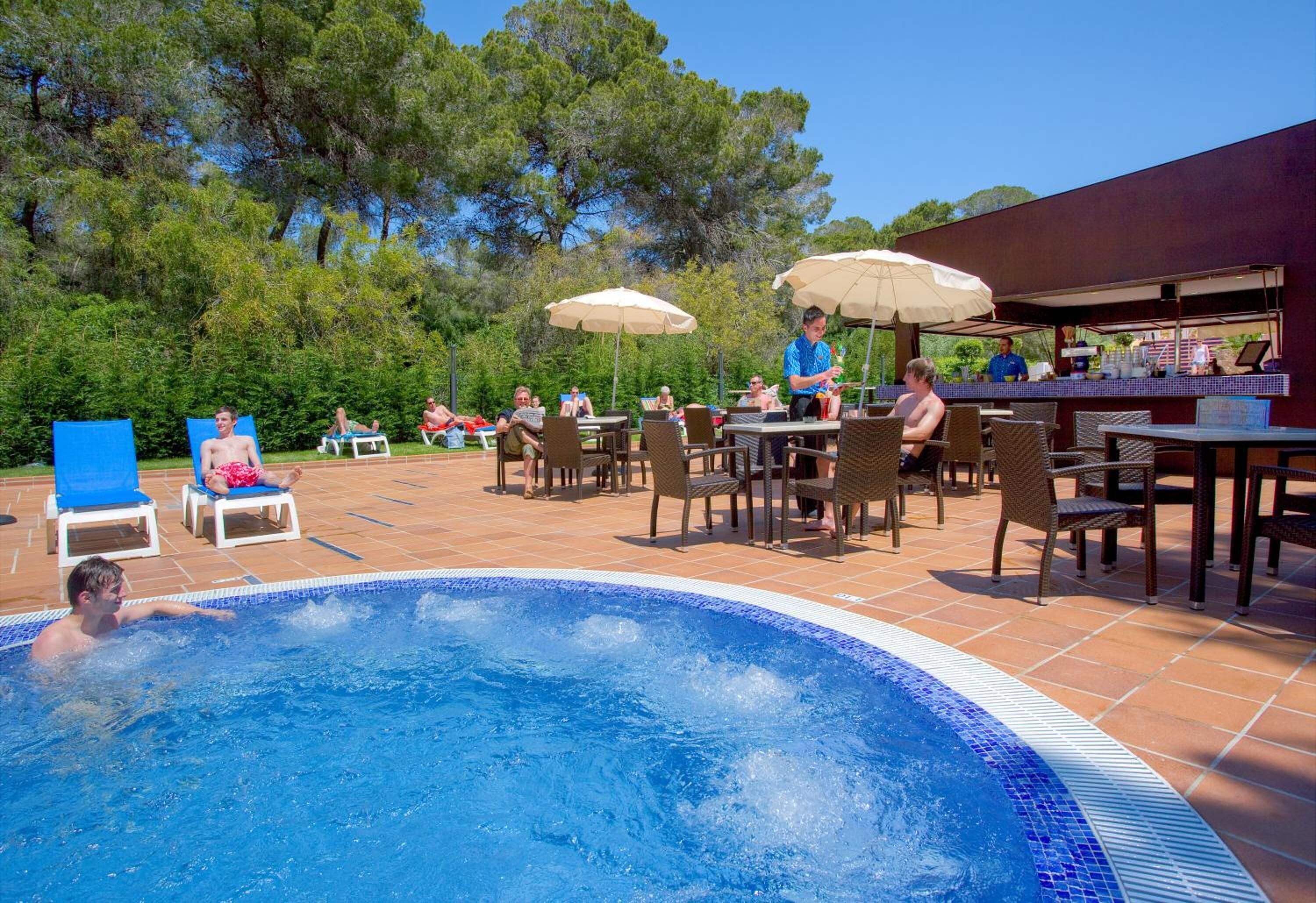 indoor pool, seasonal outdoor pool, pool umbrellas, pool loungers