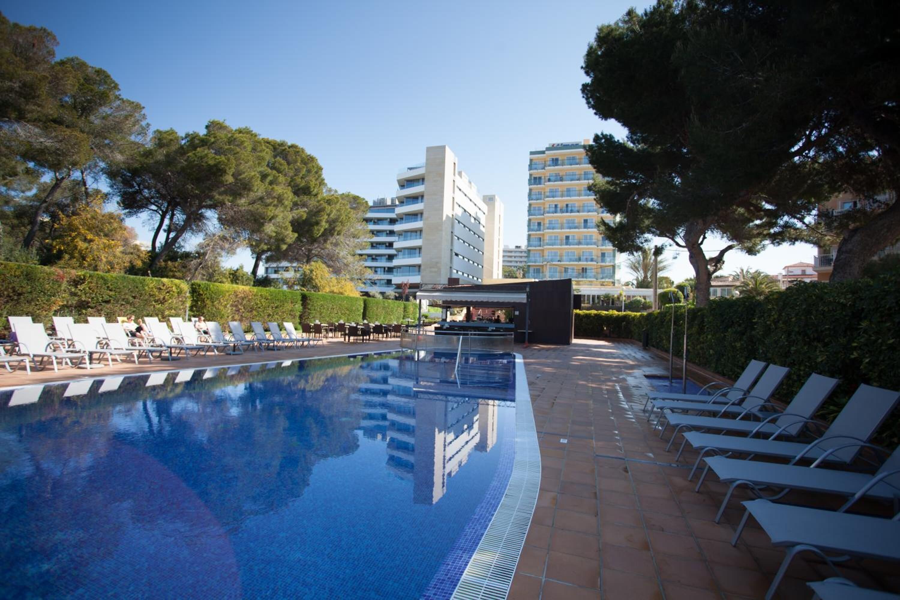 indoor pool, seasonal outdoor pool, pool umbrellas, pool loungers