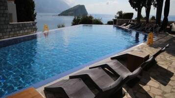 Indoor pool, 2 outdoor pools, open 8 AM to 9 PM, pool umbrellas