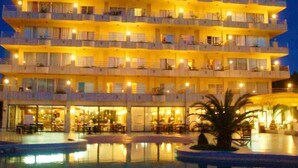 A multi-story hotel with balconies and a pool area in the foreground. - BJ Playa Blanca (Sant Llorenc des Cardassar)