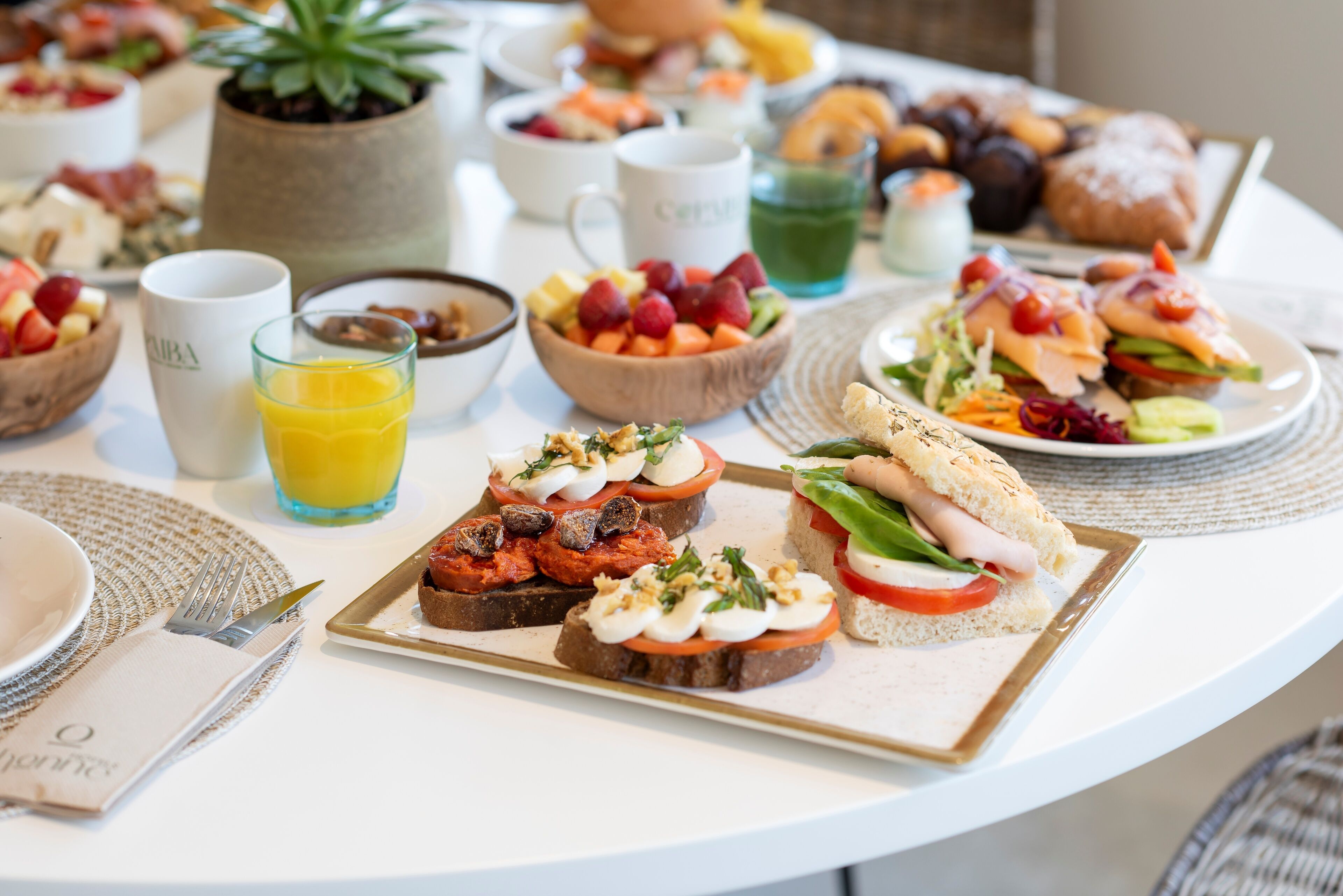 A breakfast buffet with various food items and beverages.