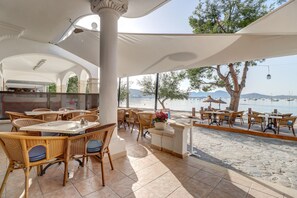 On the beach, white sand, beach towels, beach bar
