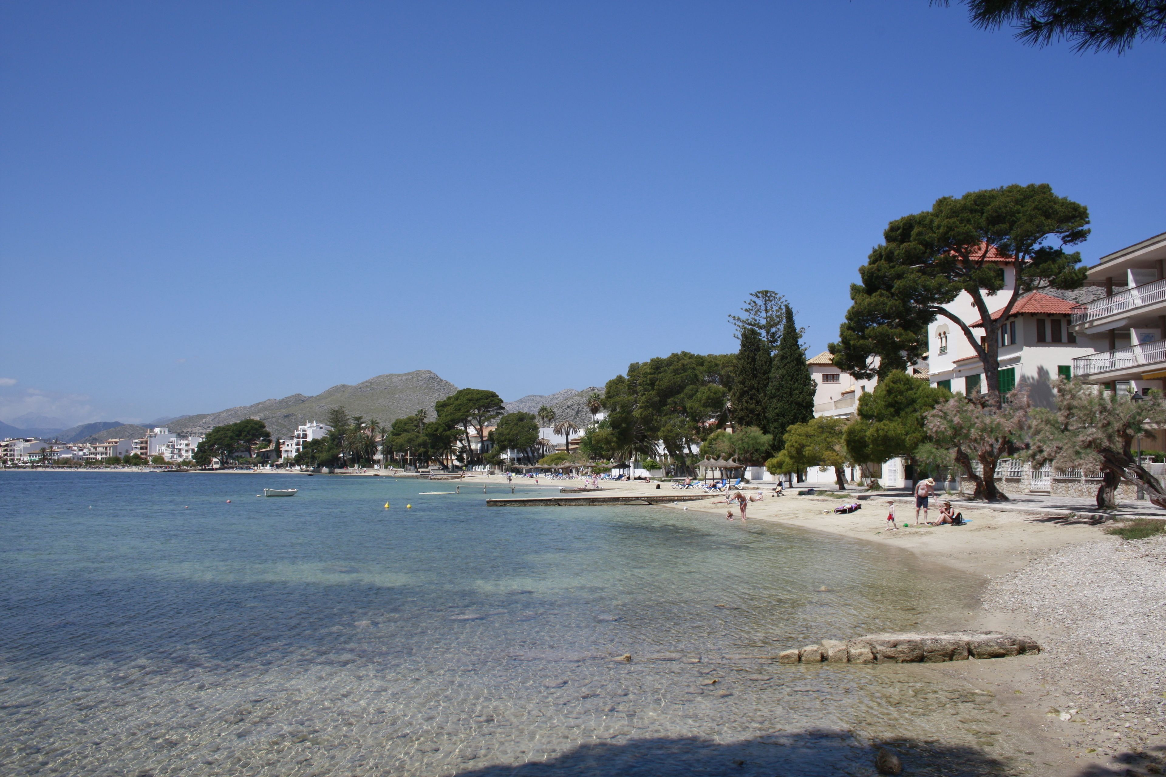 on the beach, white sand, beach towels, beach bar