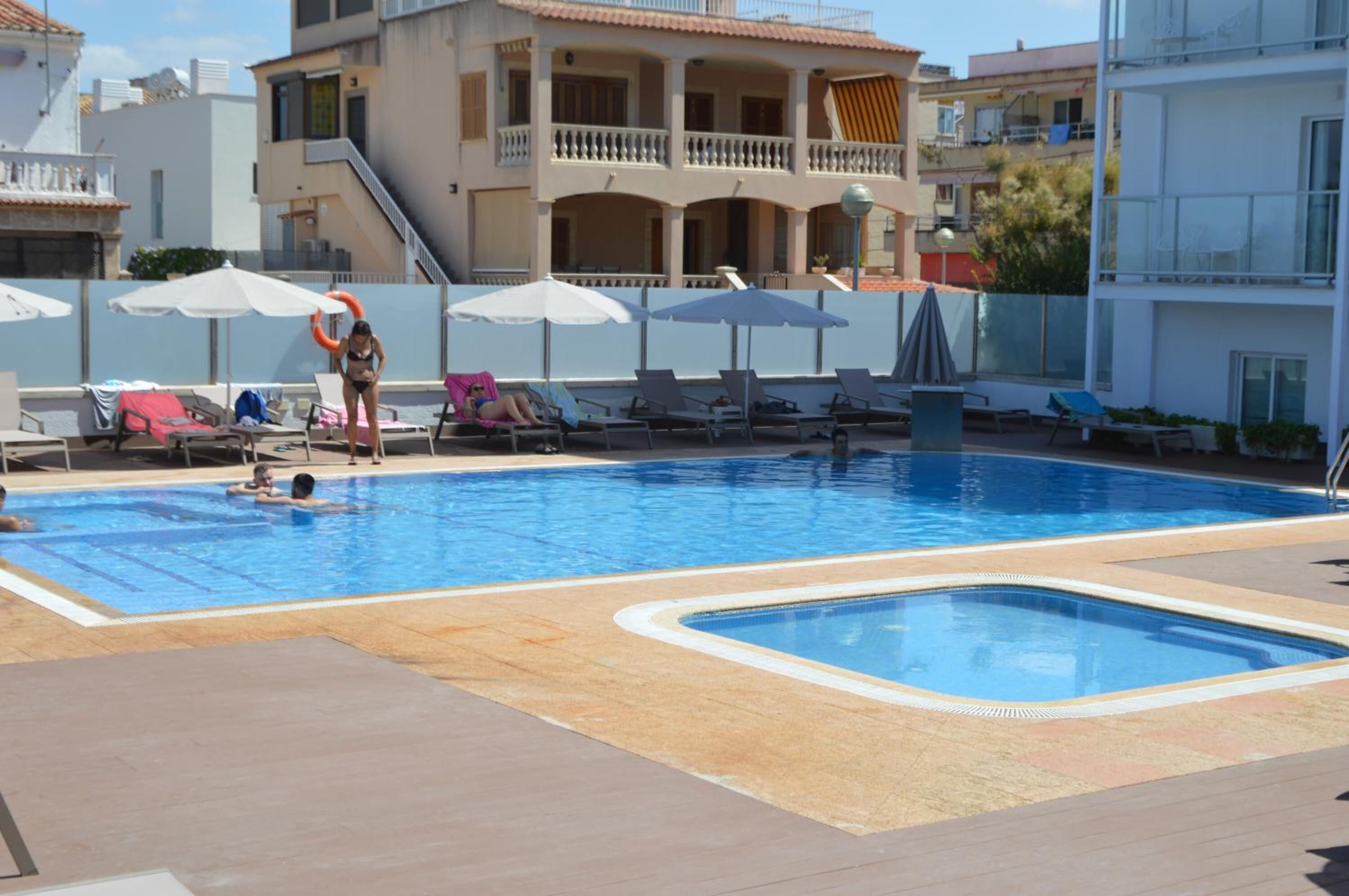 seasonal outdoor pool, pool umbrellas, pool loungers