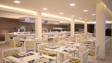 A spacious dining area with multiple tables and chairs, a central kitchen area, and modern lighting.