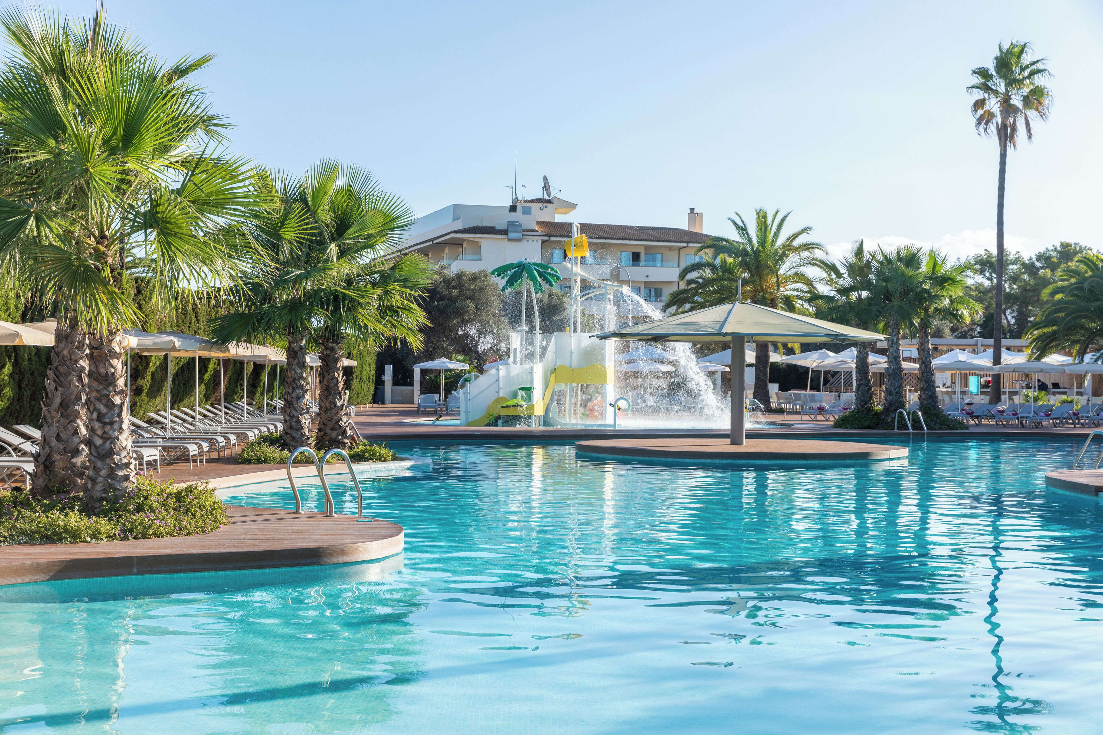 outdoor pool, pool umbrellas, pool loungers