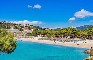 White sand, sun-loungers, beach umbrellas