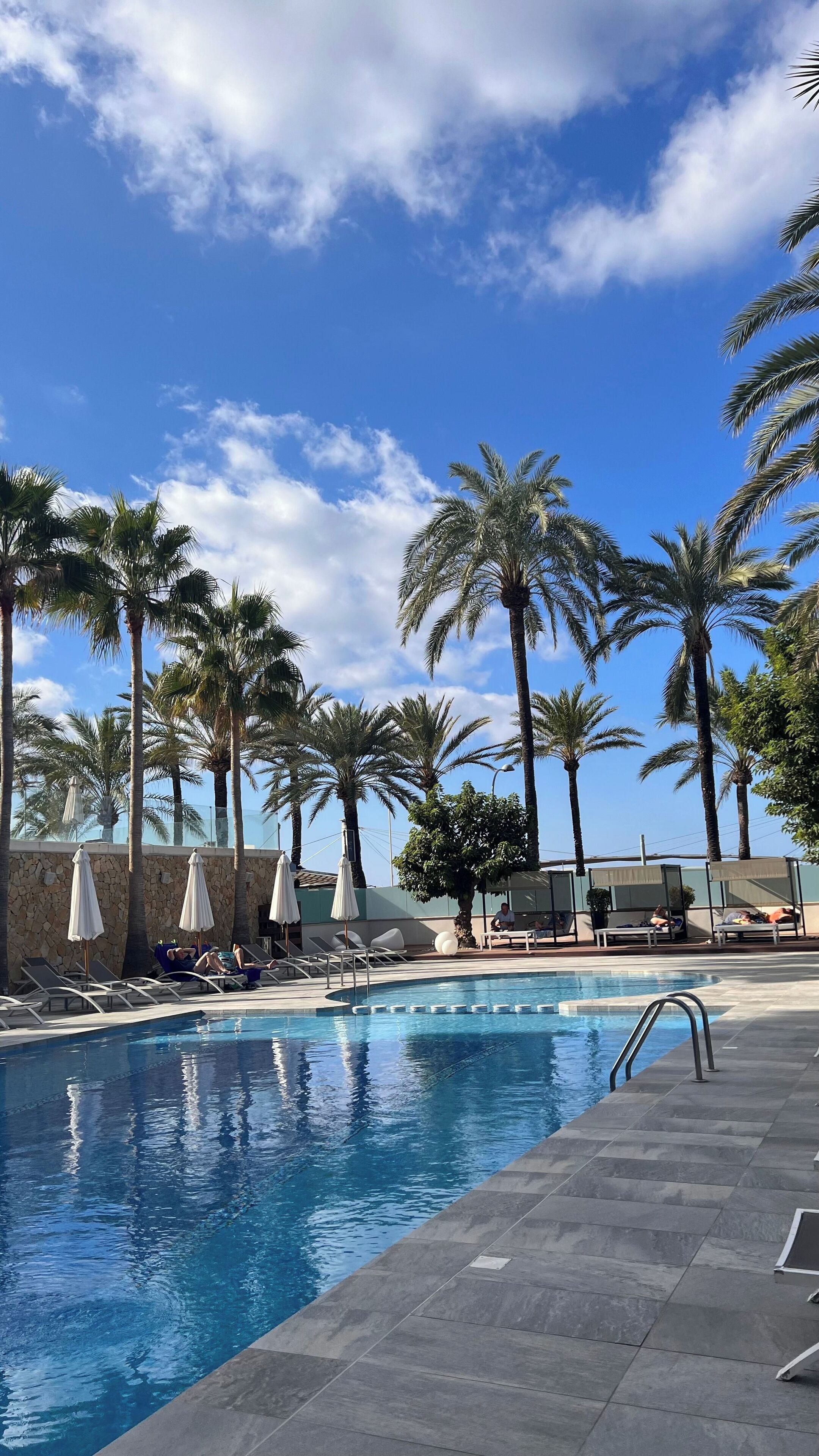 outdoor pool, pool umbrellas, pool loungers