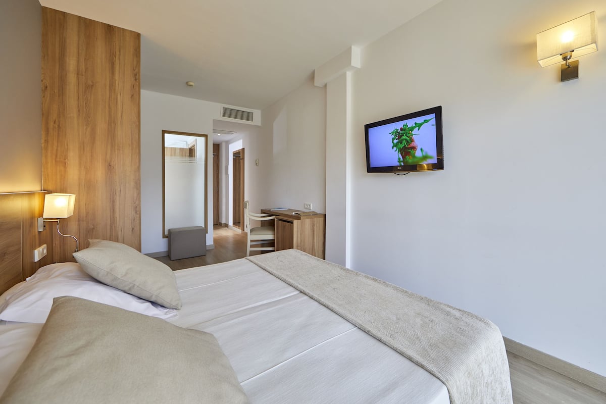 Ropa de cama de alta calidad y minibar