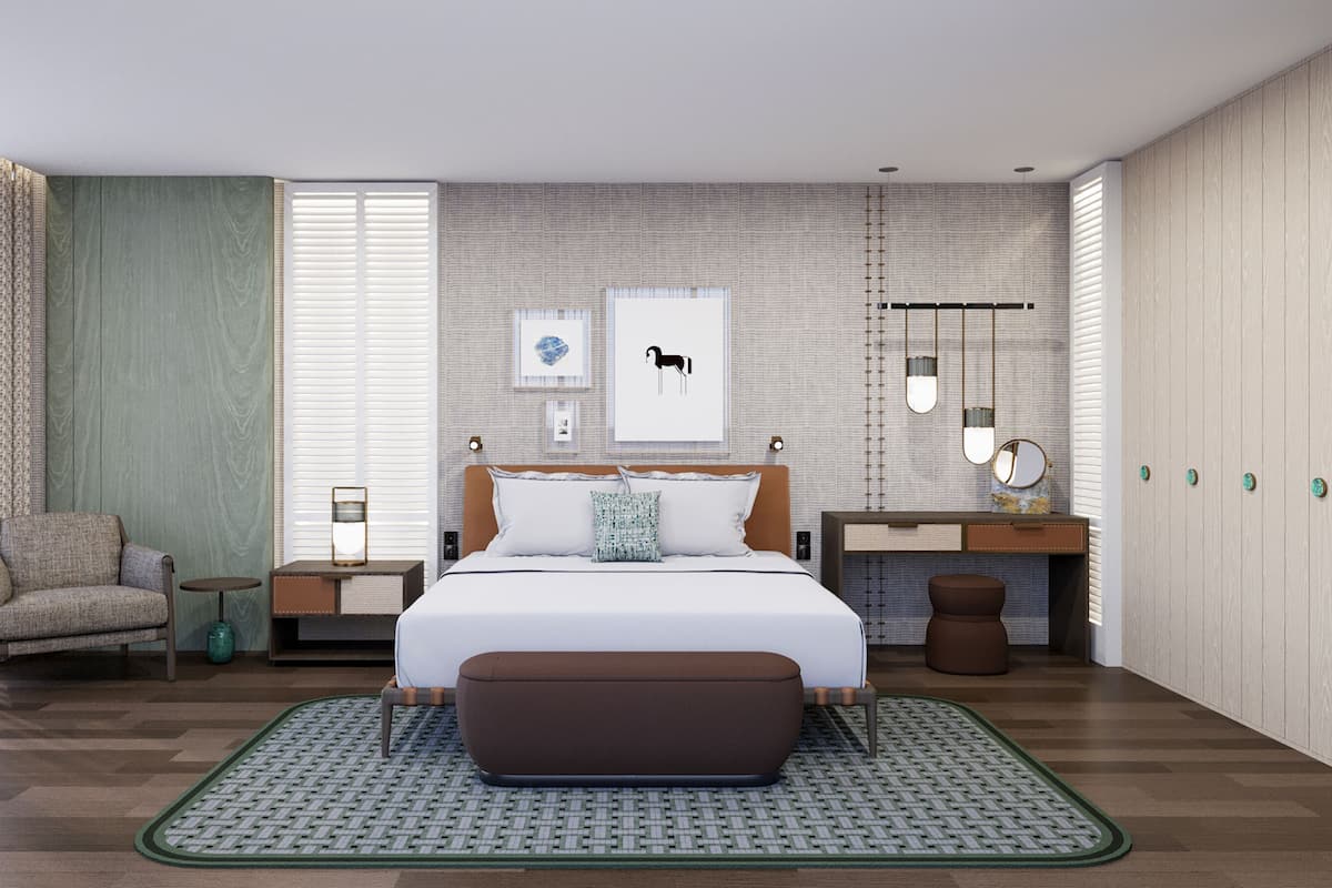 A modern bedroom with a large bed, a side table, a chair, and a small desk with a mirror.