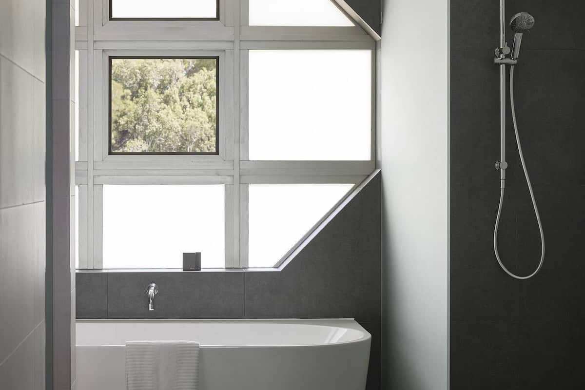 superior suite | bathroom | separate bathtub and shower, free toiletries, hair dryer, towels