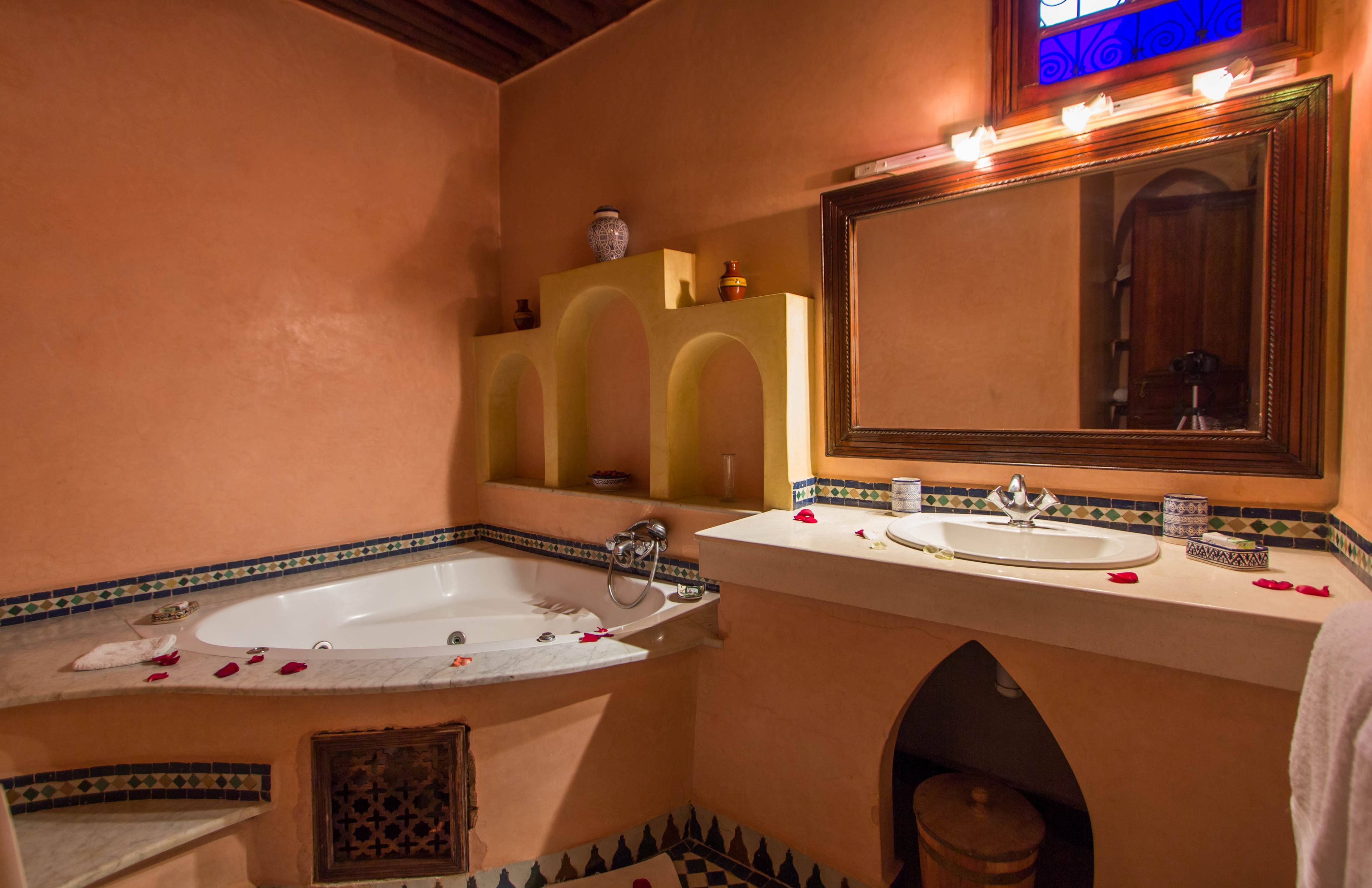deluxe suite, jetted tub | bathroom | deep-soaking bathtub, free toiletries, hair dryer, bathrobes