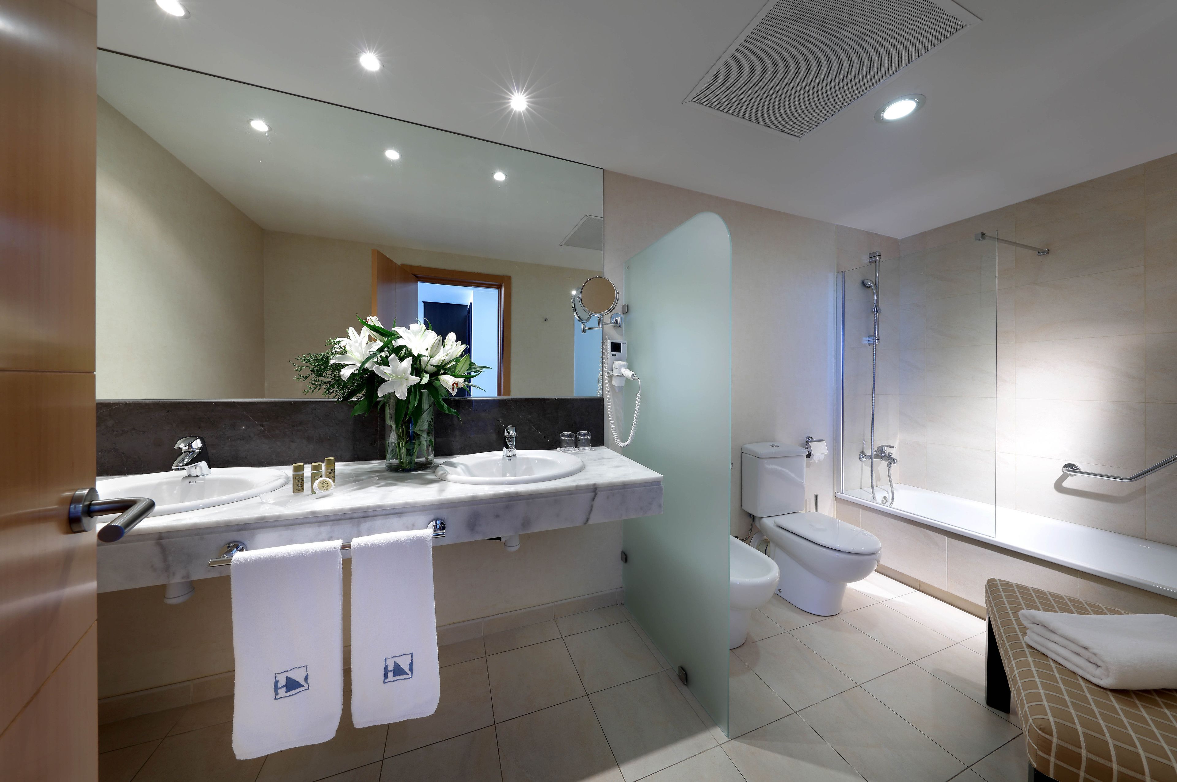 premium bedding, down duvets, minibar, in-room safe