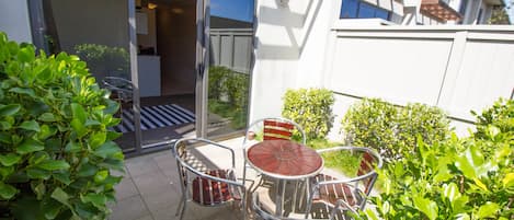 Suite, 1 King Bed, Jetted Tub, Courtyard Area | Terrace/patio