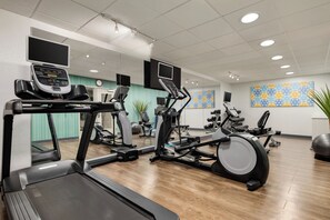 A gym with treadmills, elliptical machines, and stationary bikes. - Holiday Inn Express Hotel & Suites Atlanta-Cumming by IHG (Cumming)