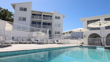 Outdoor pool, open 8:00 AM to 9:00 PM, pool umbrellas, pool loungers