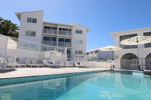 Outdoor pool, open 8:00 AM to 9:00 PM, pool umbrellas, sun loungers