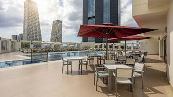 Seasonal outdoor pool, pool loungers