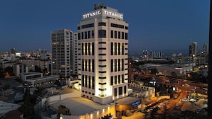 A modern building with the name 'Titanic' prominently displayed on the top. - Titanic Business Kartal (Istanbul)