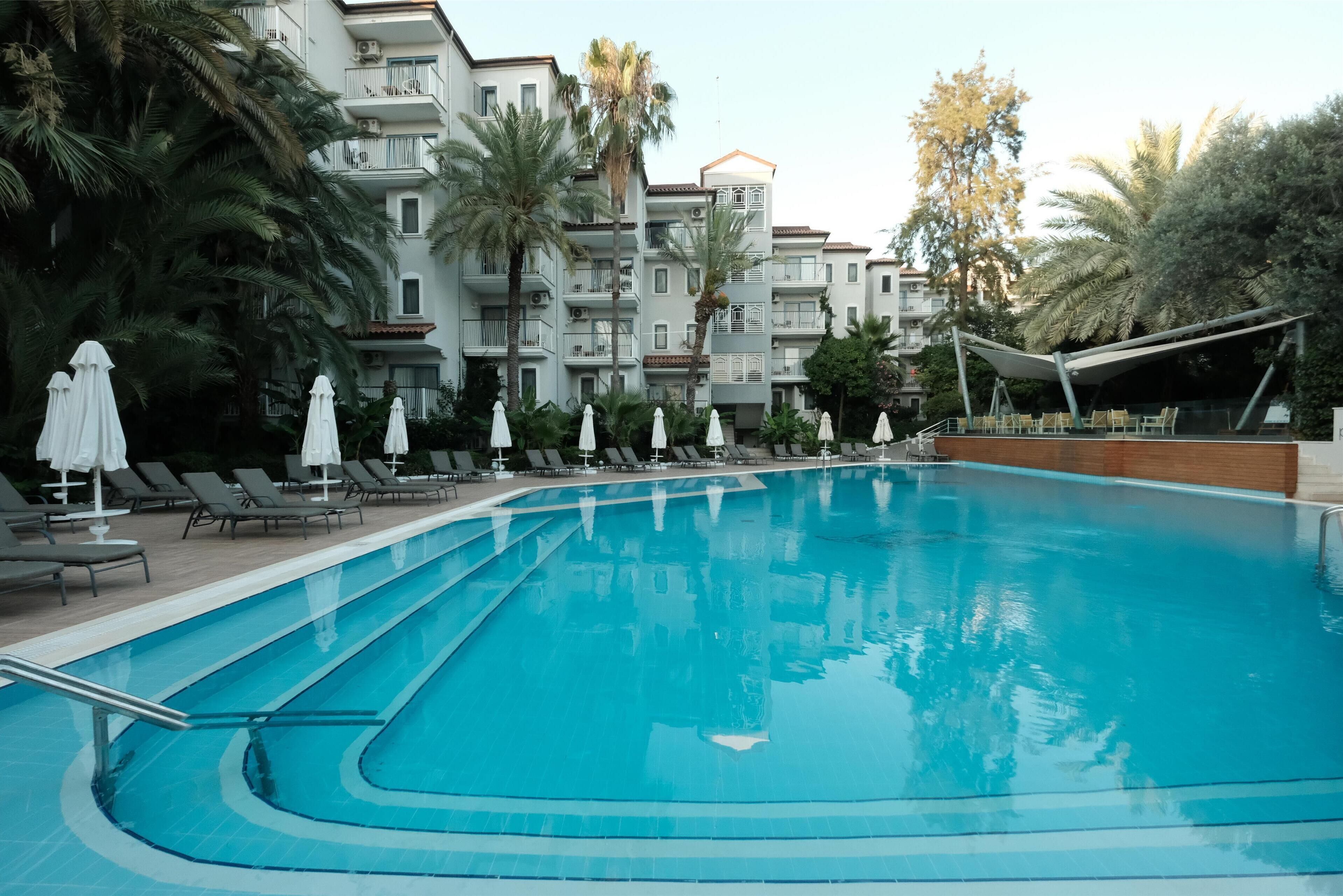 Outdoor pool, pool umbrellas, sun loungers