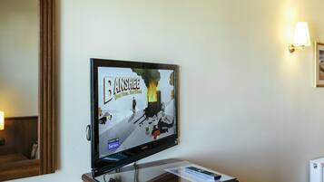 A television mounted on a wall displaying a game.