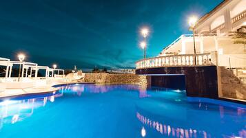 Indoor pool, outdoor pool, open 10 AM to 8 PM, pool umbrellas