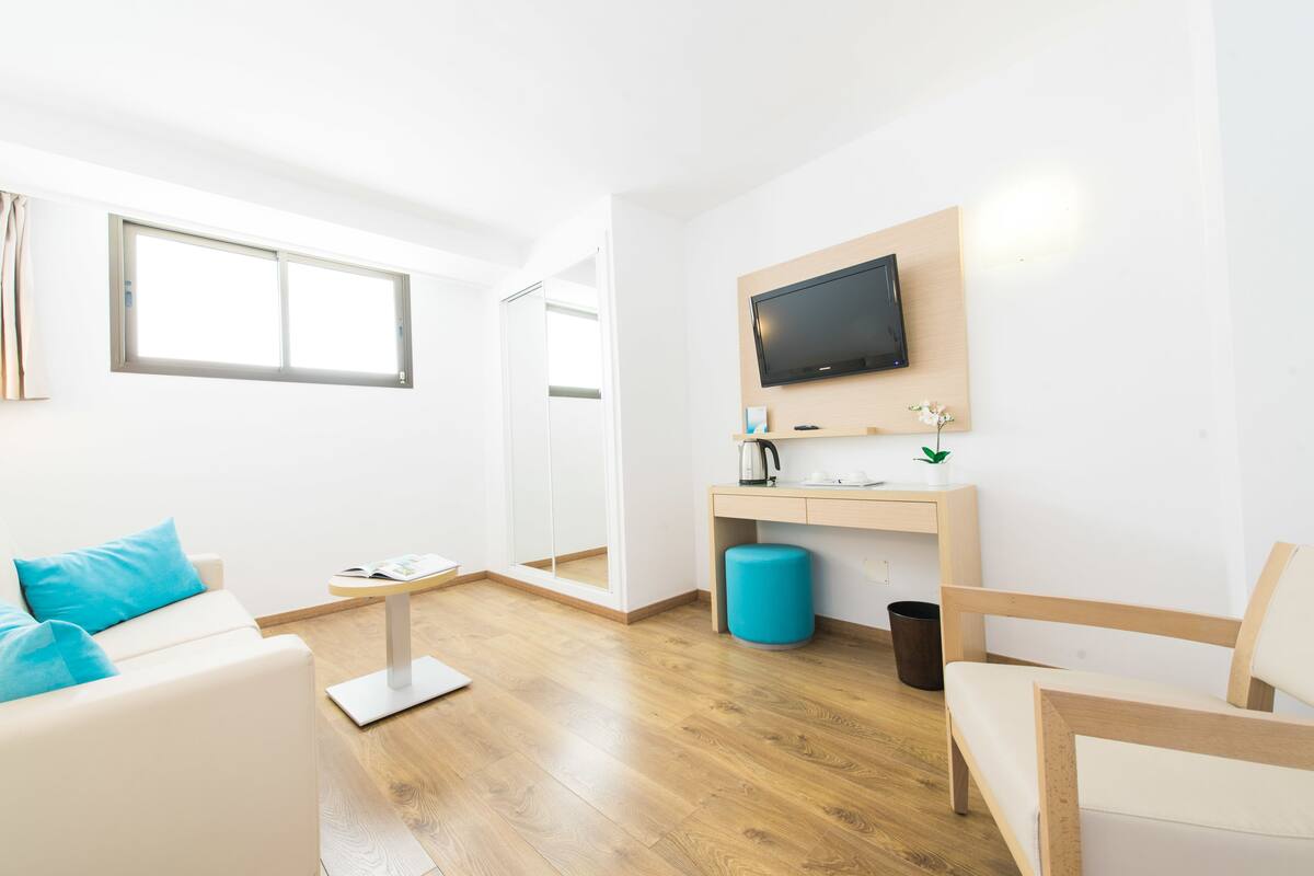 Panoramic Suite, Sea View | Down comforters, minibar, in-room safe, desk