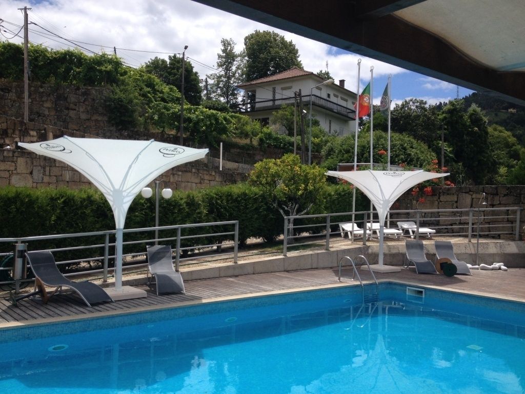 seasonal outdoor pool, open 10 am to 8 pm, pool umbrellas, pool loungers