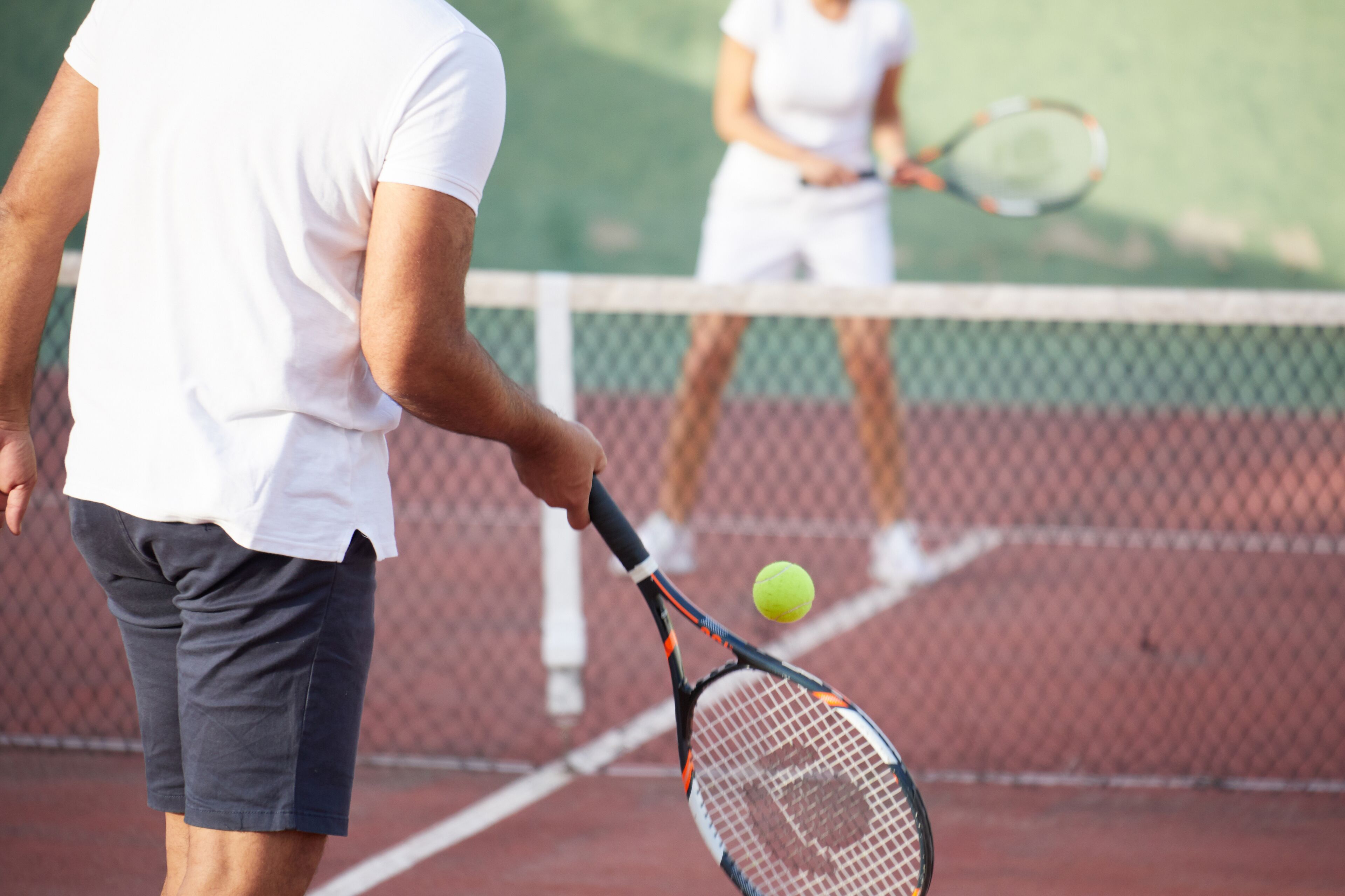 A tennis court with a net in the middle.