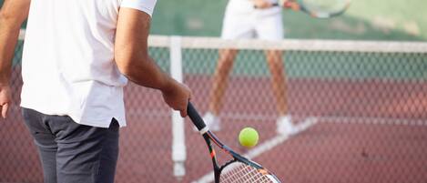 A tennis court with a net in the middle.