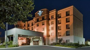 A multi-story hotel with a prominent entrance and a sign indicating it is a Homewood Suites. - Homewood Suites by Hilton San Antonio North (San Antonio)
