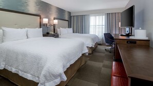 A hotel room with two beds, a desk, a TV, and a chair. - Hampton Inn & Suites San Diego-Poway (Poway)