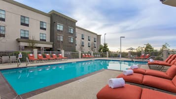 Outdoor pool, open 7:00 AM to 10:00 PM, sun loungers