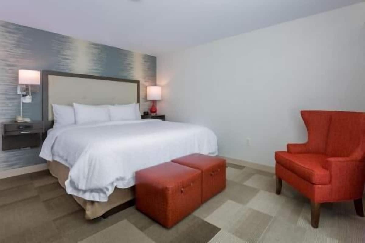 Premium bedding, desk, laptop workspace, blackout drapes