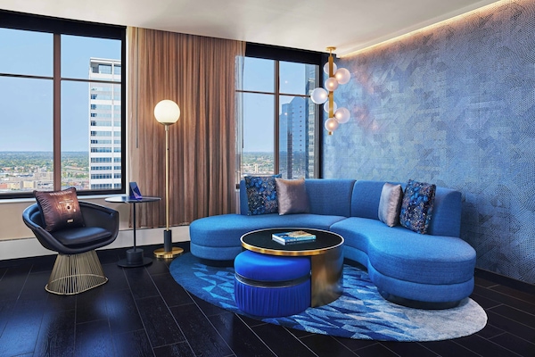 Suite, 1 King Bed | Living room | 37-inch LCD TV with cable channels, TV, DVD player