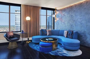 Suite, 1 King Bed | Living room | 37-inch LCD TV with cable channels, TV, DVD player