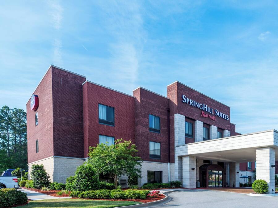 A brick building with a sign reading "SpringHill Suites by Marriott."