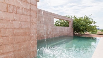 Seasonal outdoor pool, open 11 AM to 9 PM, pool umbrellas, pool loungers